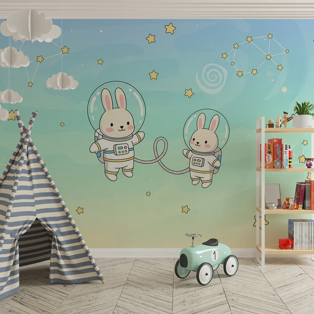 Papel de parede quarto bebê | Coelhos astronautas flutuando entre as estrelas